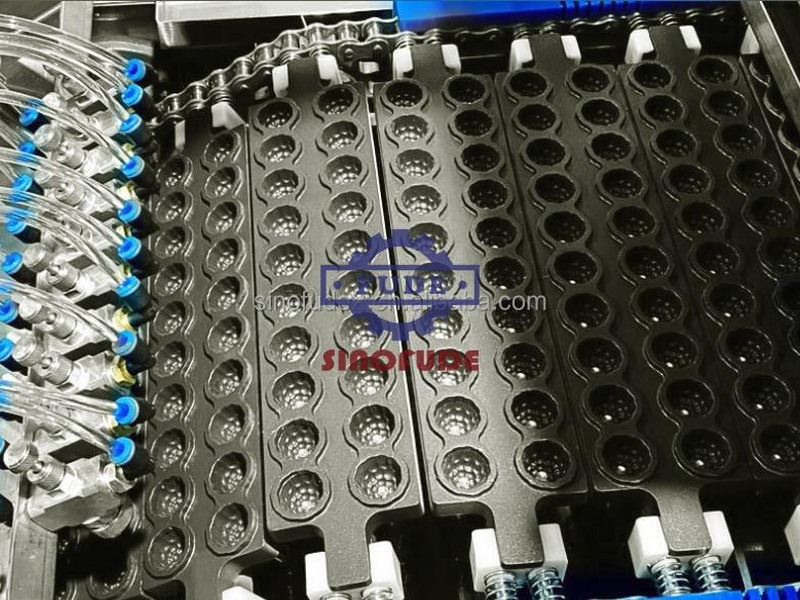 Servo depositing nozzles positioned above metal gummy mould trays